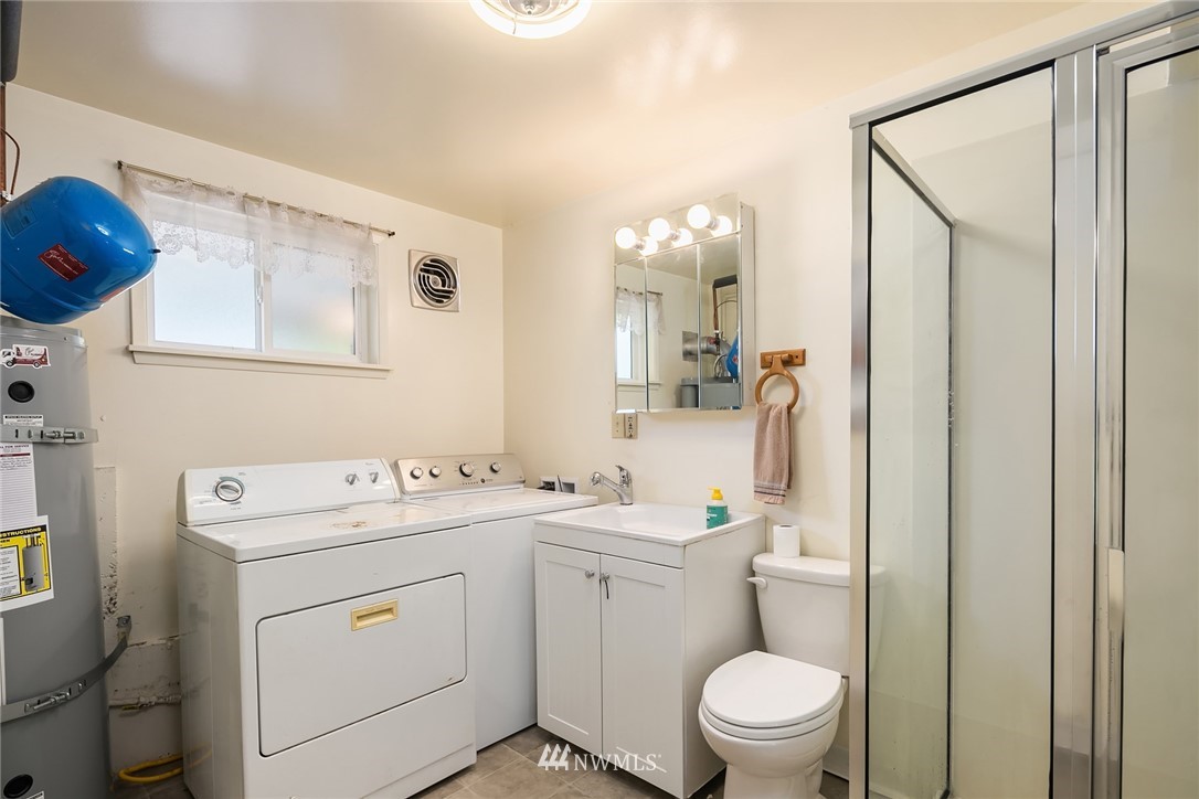9229 217th Place Southwest Edmonds, WA 98020 - Photo 30 of 38 a bathroom with a sink a toilet and a mirror