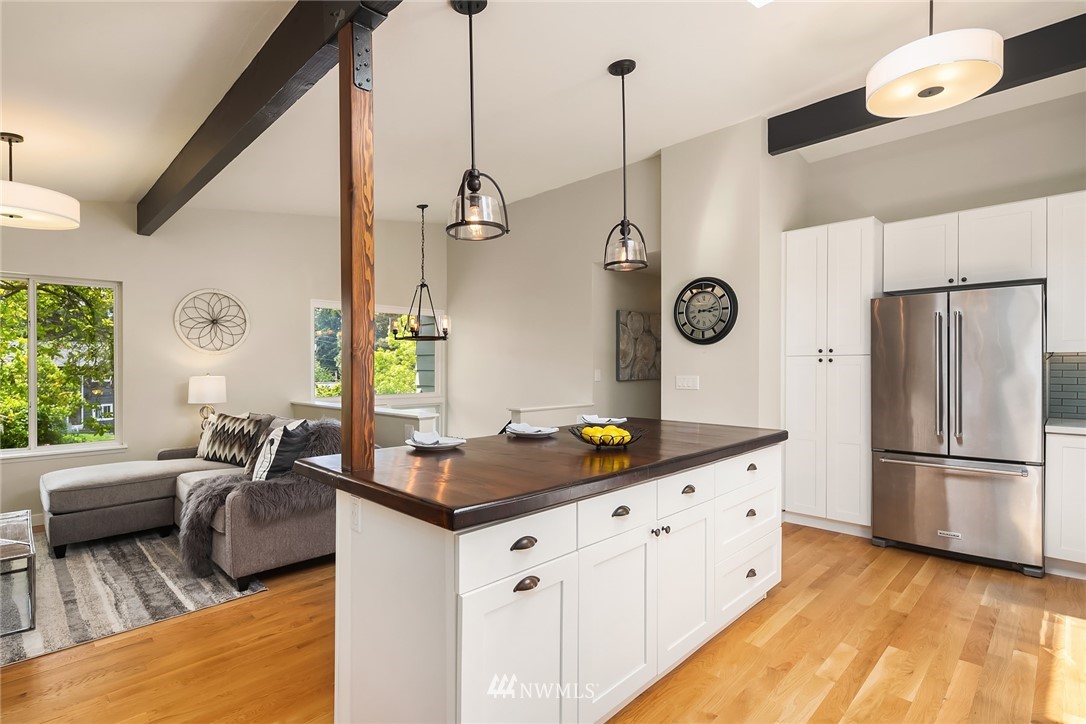 9229 217th Place Southwest Edmonds, WA 98020 - Photo 8 of 38 a kitchen with stainless steel appliances granite countertop a sink a stove and a refrigerator