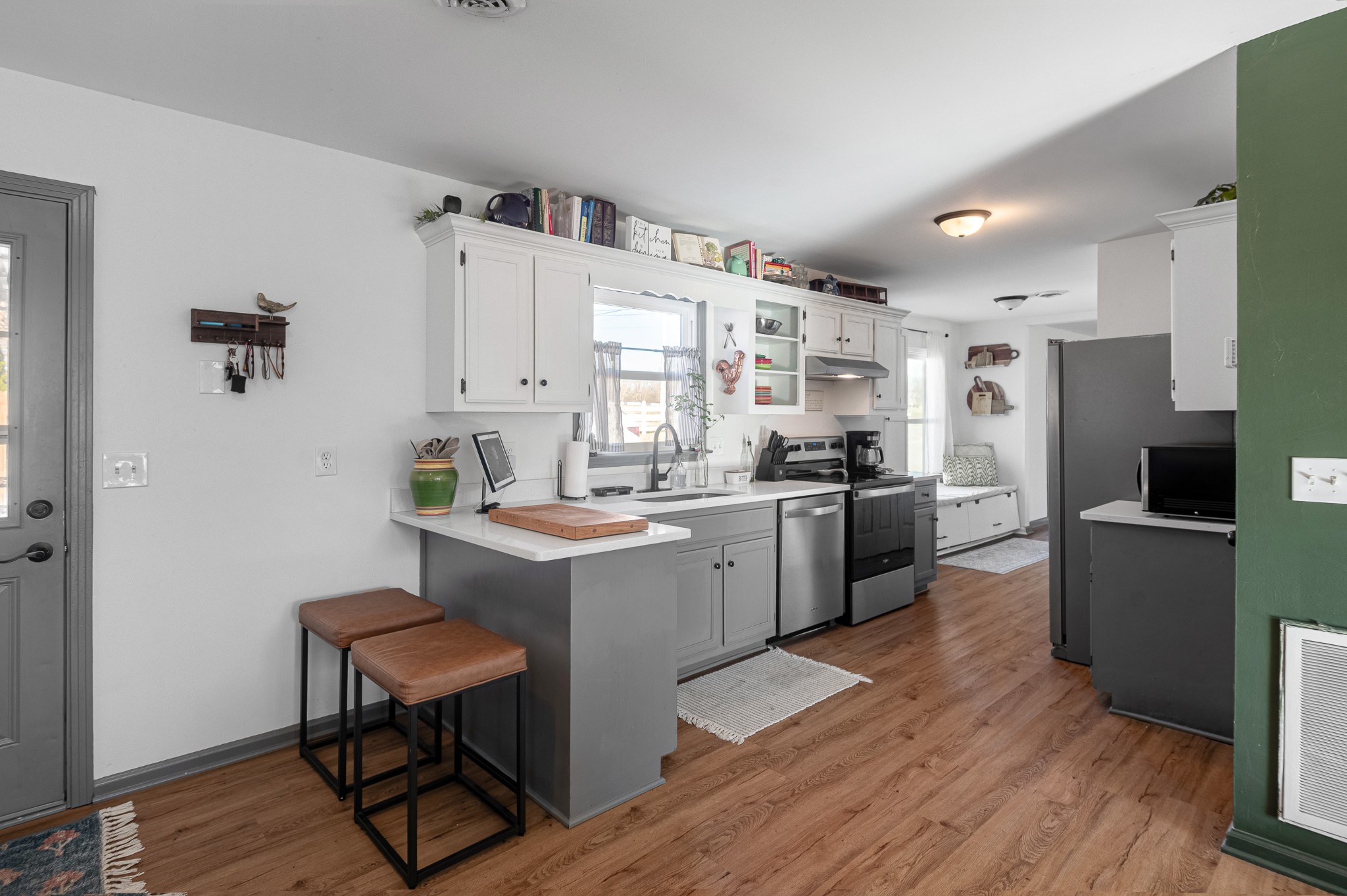 8522 Coles Ferry Pike Lebanon, TN 37087 - Photo 12 of 35 a kitchen with white cabinets and stainless steel appliances