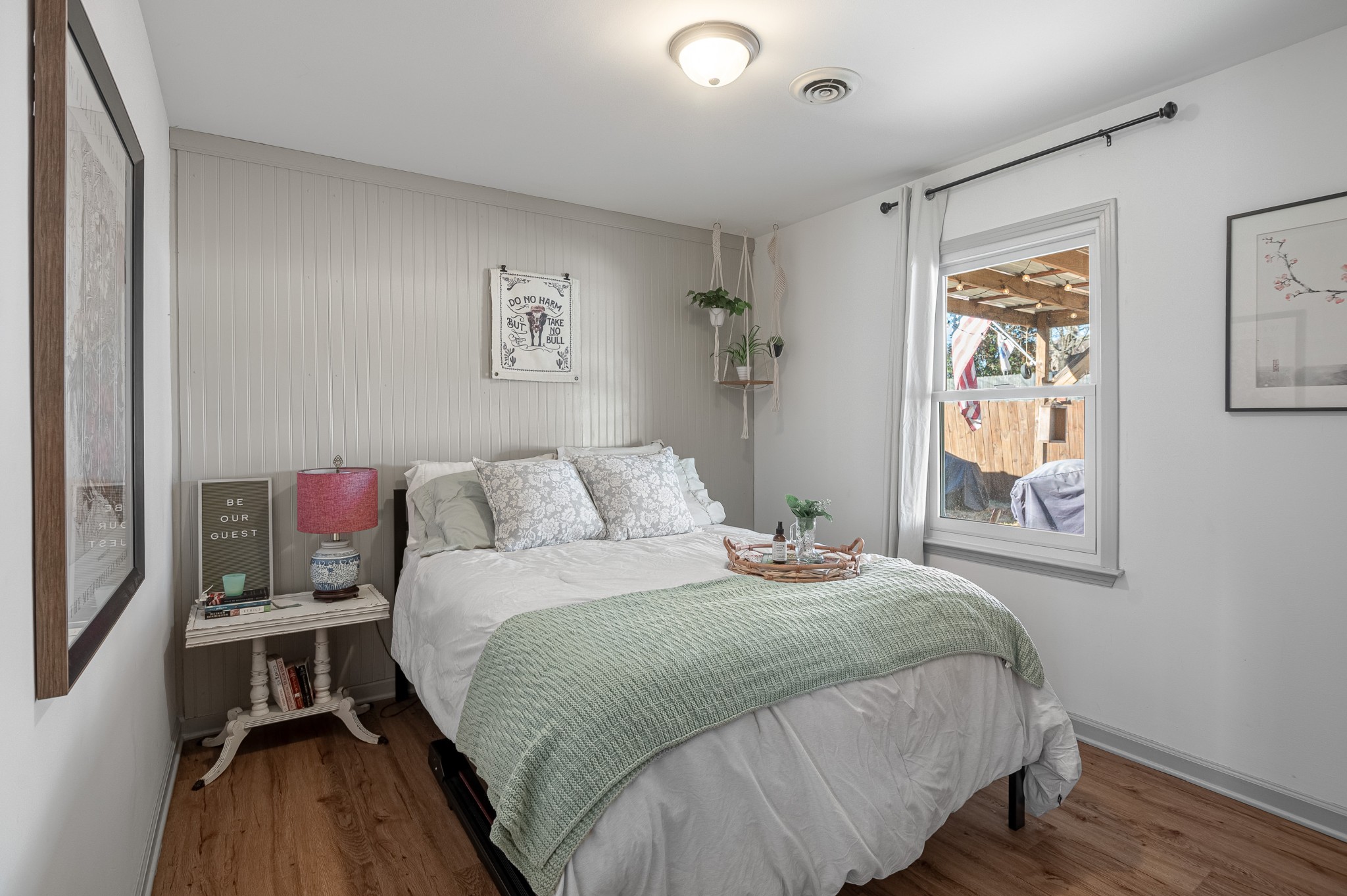 8522 Coles Ferry Pike Lebanon, TN 37087 - Photo 20 of 35 a bedroom with a bed and a painting on the wall