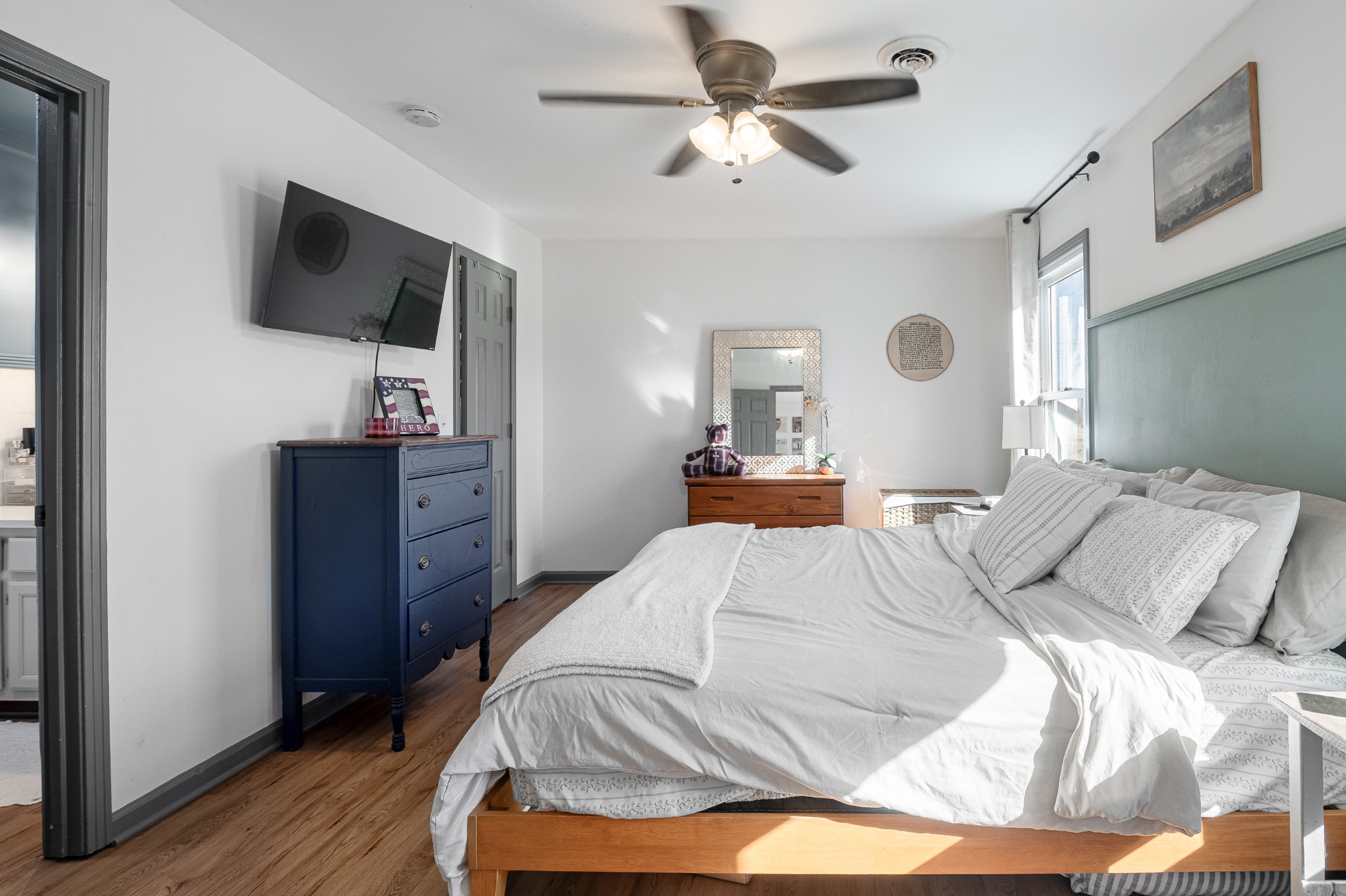 8522 Coles Ferry Pike Lebanon, TN 37087 - Photo 25 of 35 a bedroom with a bed a window and a flat screen tv