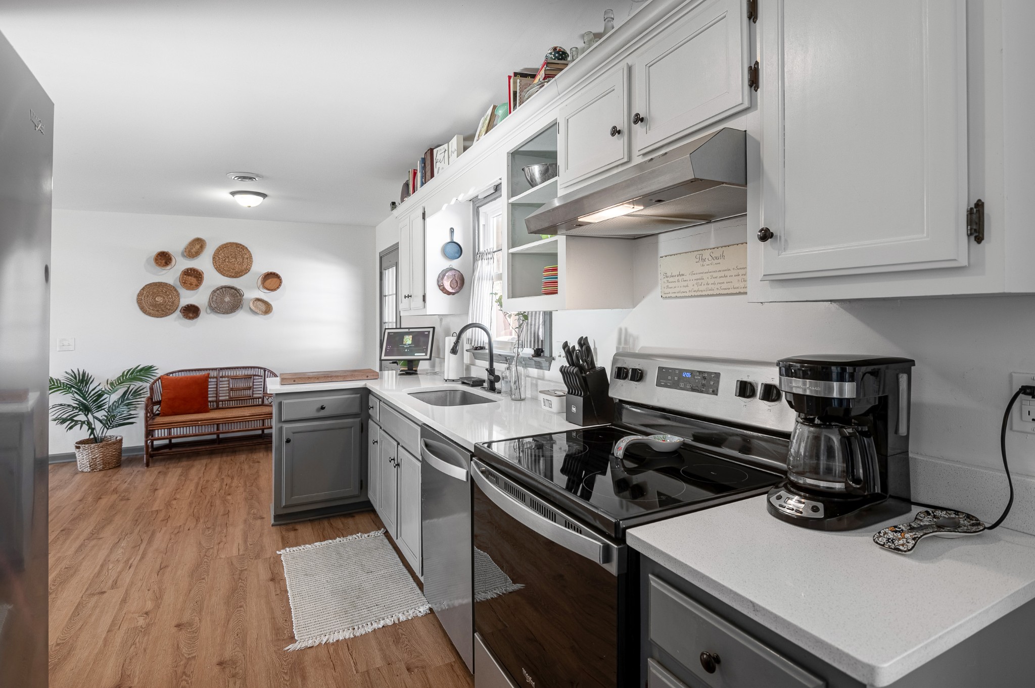 8522 Coles Ferry Pike Lebanon, TN 37087 - Photo 10 of 35 a kitchen with a stove and a wooden floor
