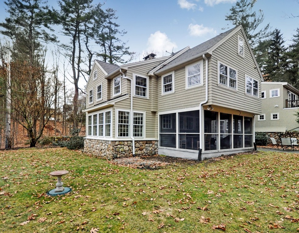 24 Ridge Road Concord, MA 01742 - Photo 11 of 25 a front view of a house with a yard