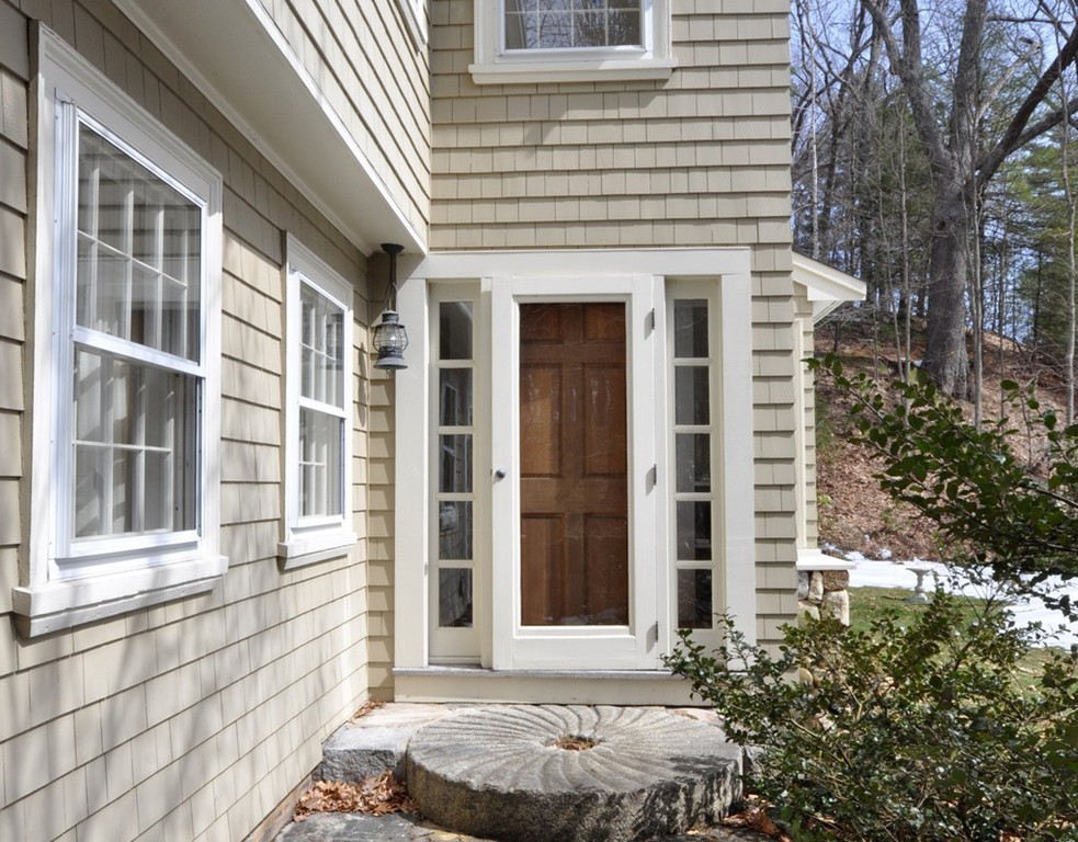 24 Ridge Road Concord, MA 01742 - Photo 13 of 25 a front view of a house with a yard