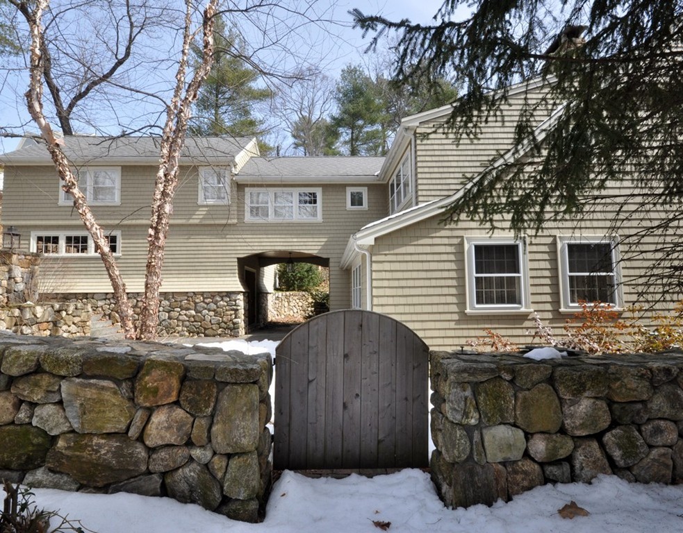 24 Ridge Road Concord, MA 01742 - Photo 15 of 25 a front view of a house with parking