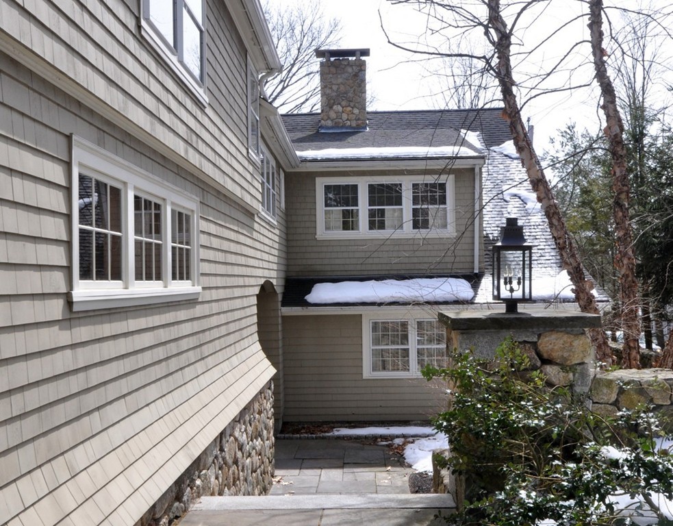 24 Ridge Road Concord, MA 01742 - Photo 19 of 25 a front view of a house with a garden