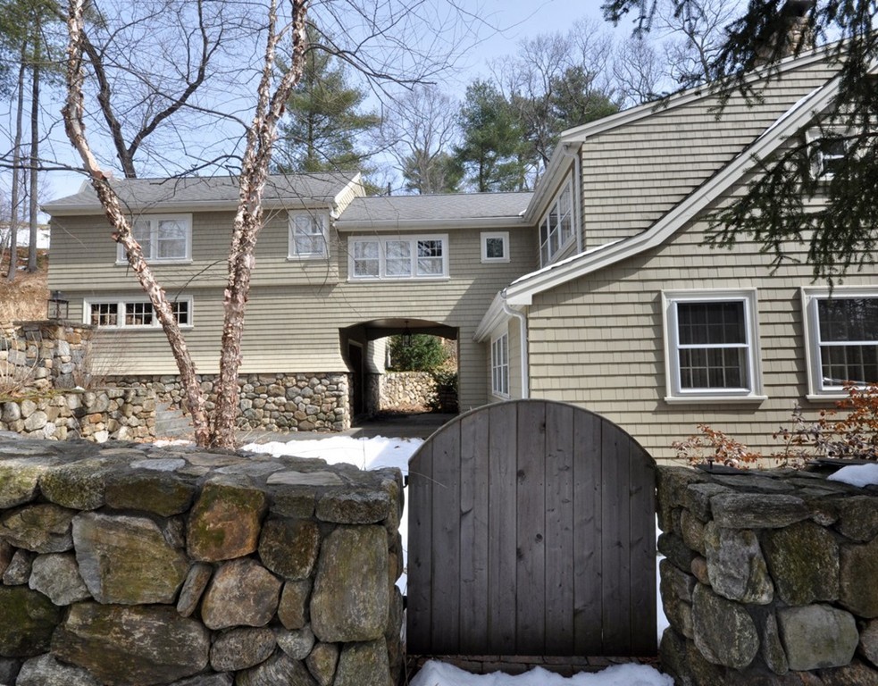 24 Ridge Road Concord, MA 01742 - Photo 20 of 25 a backyard of a house with wooden fence and large tree