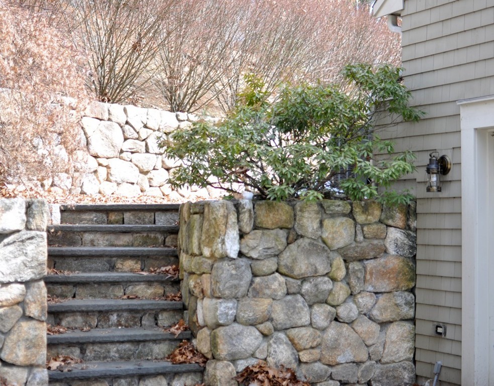 24 Ridge Road Concord, MA 01742 - Photo 22 of 25 a view of a bench in a yard