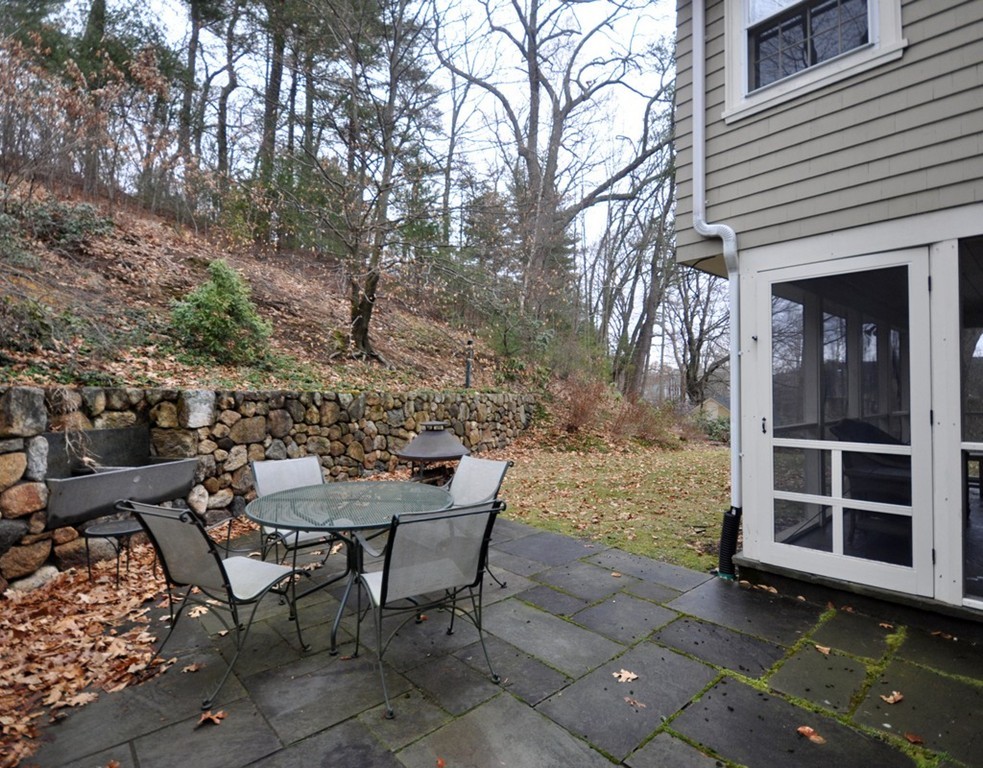 24 Ridge Road Concord, MA 01742 - Photo 24 of 25 a view of a chairs and table in backyard of the house