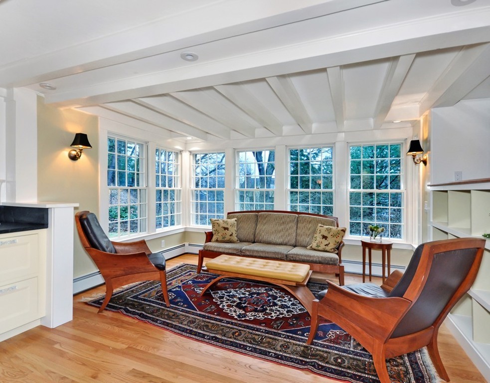 24 Ridge Road Concord, MA 01742 - Photo 3 of 25 a living room with furniture a large window and a table