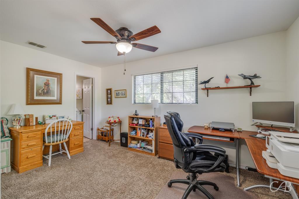 103 Arrow Point Abilene, TX 79601 - Photo 15 of 40 a view of a workspace with furniture and a window