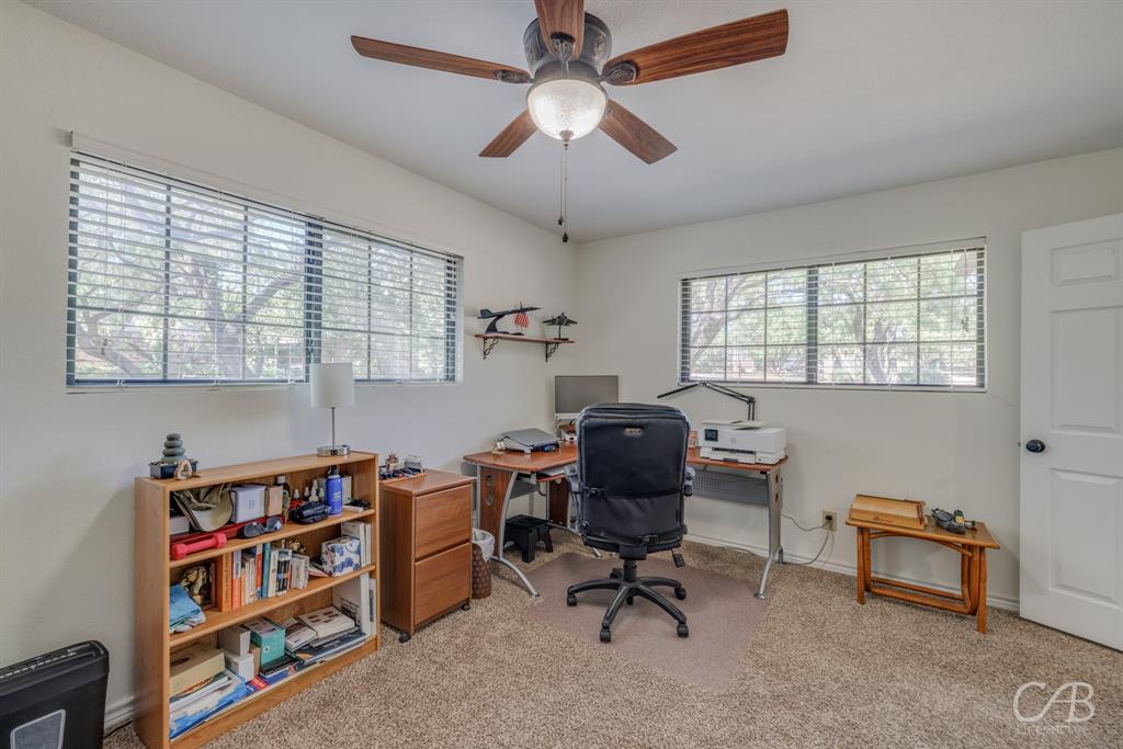 103 Arrow Point Abilene, TX 79601 - Photo 16 of 40 a view of a workspace with furniture and a window
