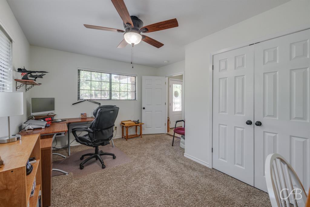 103 Arrow Point Abilene, TX 79601 - Photo 17 of 40 a view of a workspace with furniture and a window