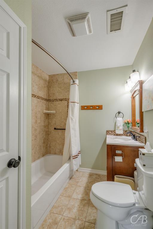 103 Arrow Point Abilene, TX 79601 - Photo 19 of 40 a white toilet sitting next to a bath tub