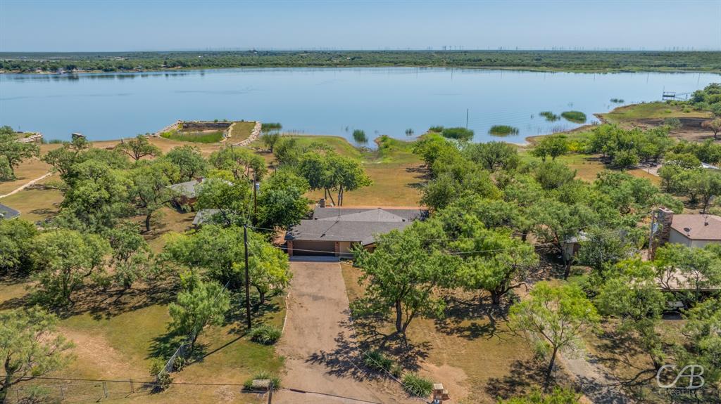 103 Arrow Point Abilene, TX 79601 - Photo 2 of 40 a view of a lake from a yard