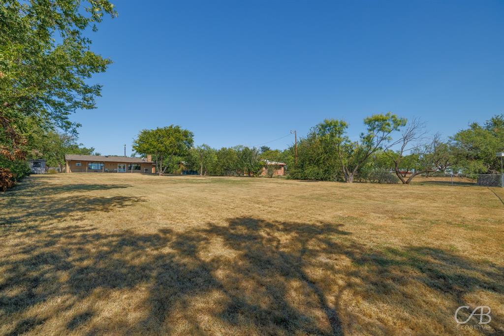 103 Arrow Point Abilene, TX 79601 - Photo 35 of 40 a view of a field with trees in background