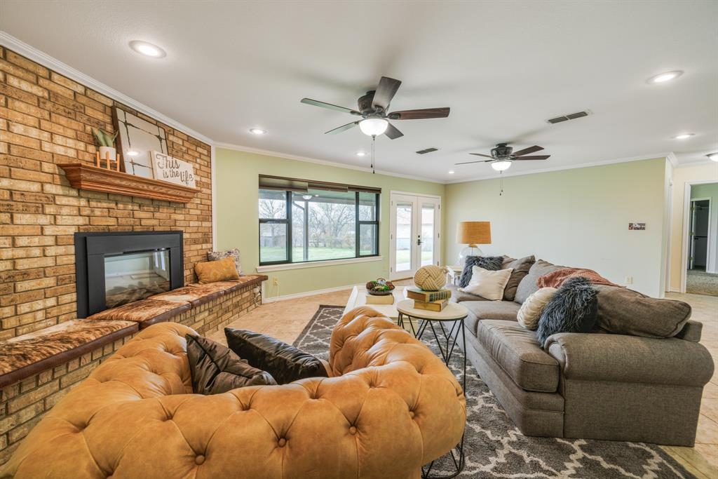 103 Arrow Point Abilene, TX 79601 - Photo 8 of 40 a living room with furniture fireplace and a flat screen tv