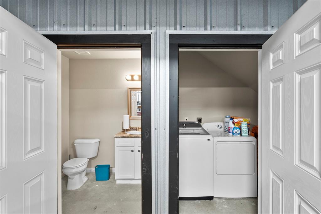 1404 McConnell Road Gunter, TX 75058 - Photo 19 of 27 a bathroom with a sink toilet and vanity