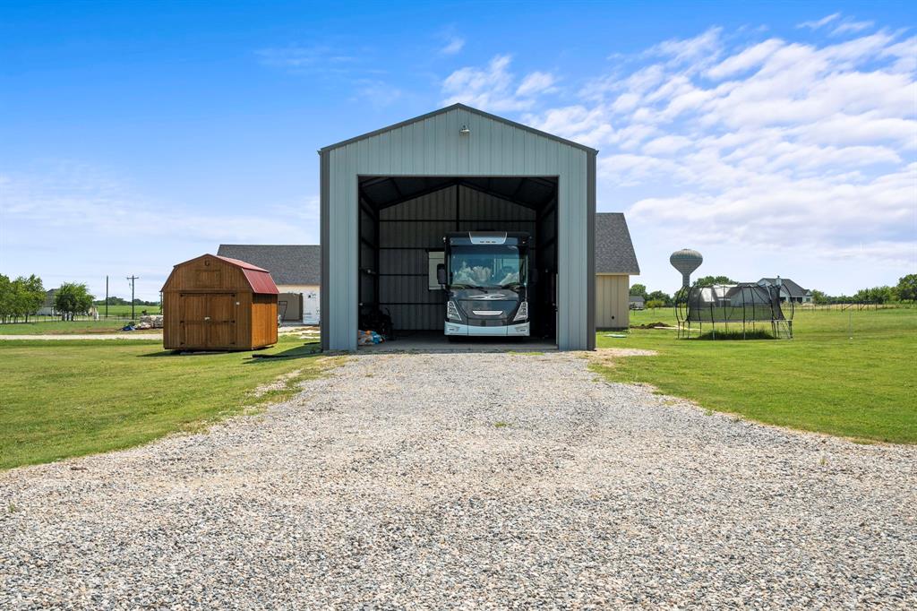 1404 McConnell Road Gunter, TX 75058 - Photo 23 of 27 a front view of a house with a yard