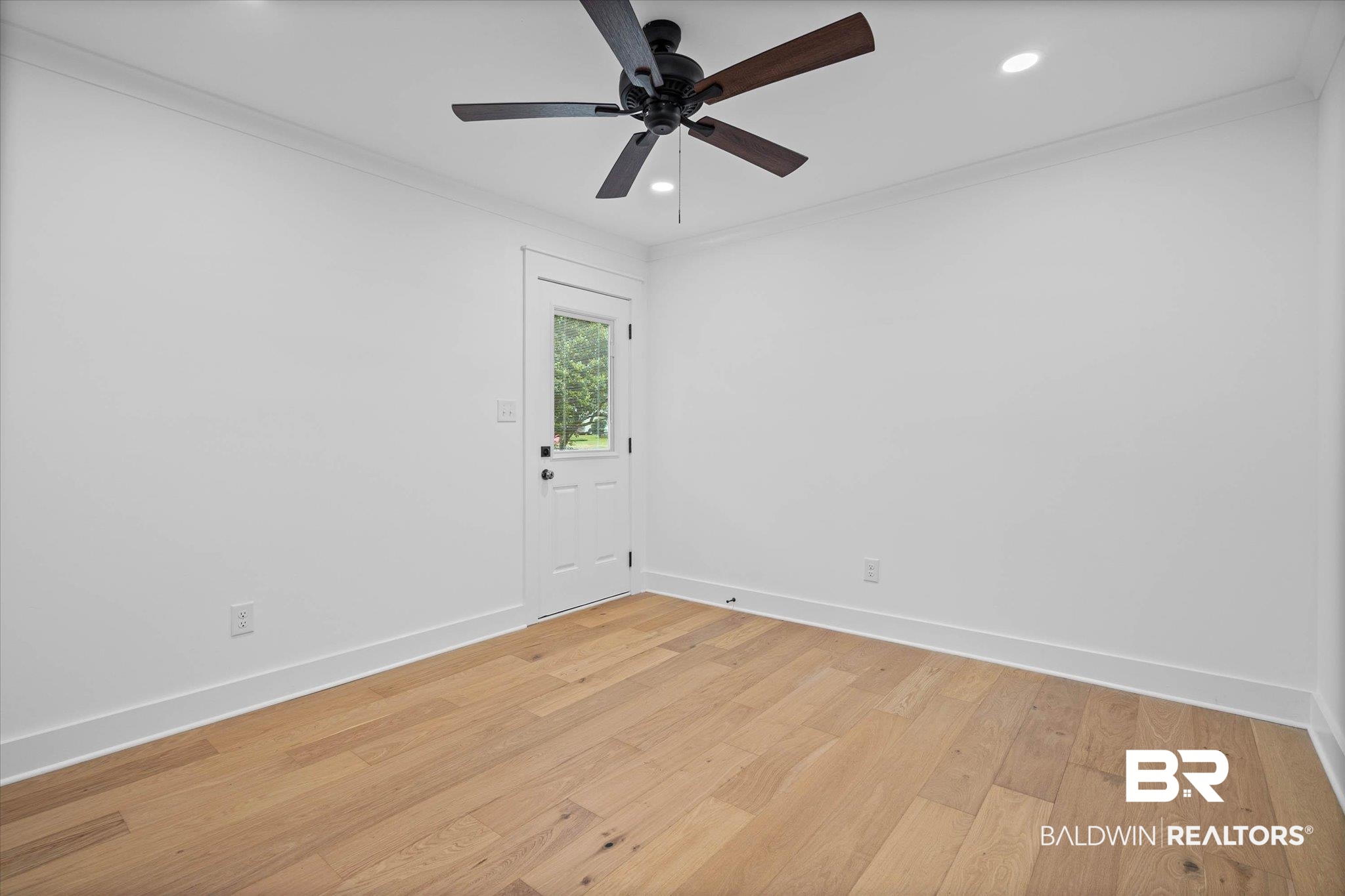 11 Schwaemmle Drive Mobile, AL 36608 - Photo 17 of 32 Empty room featuring light wood-type flooring, ornamental molding, ceiling fan, and recessed lighting