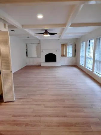 a view of livingroom with fireplace and window