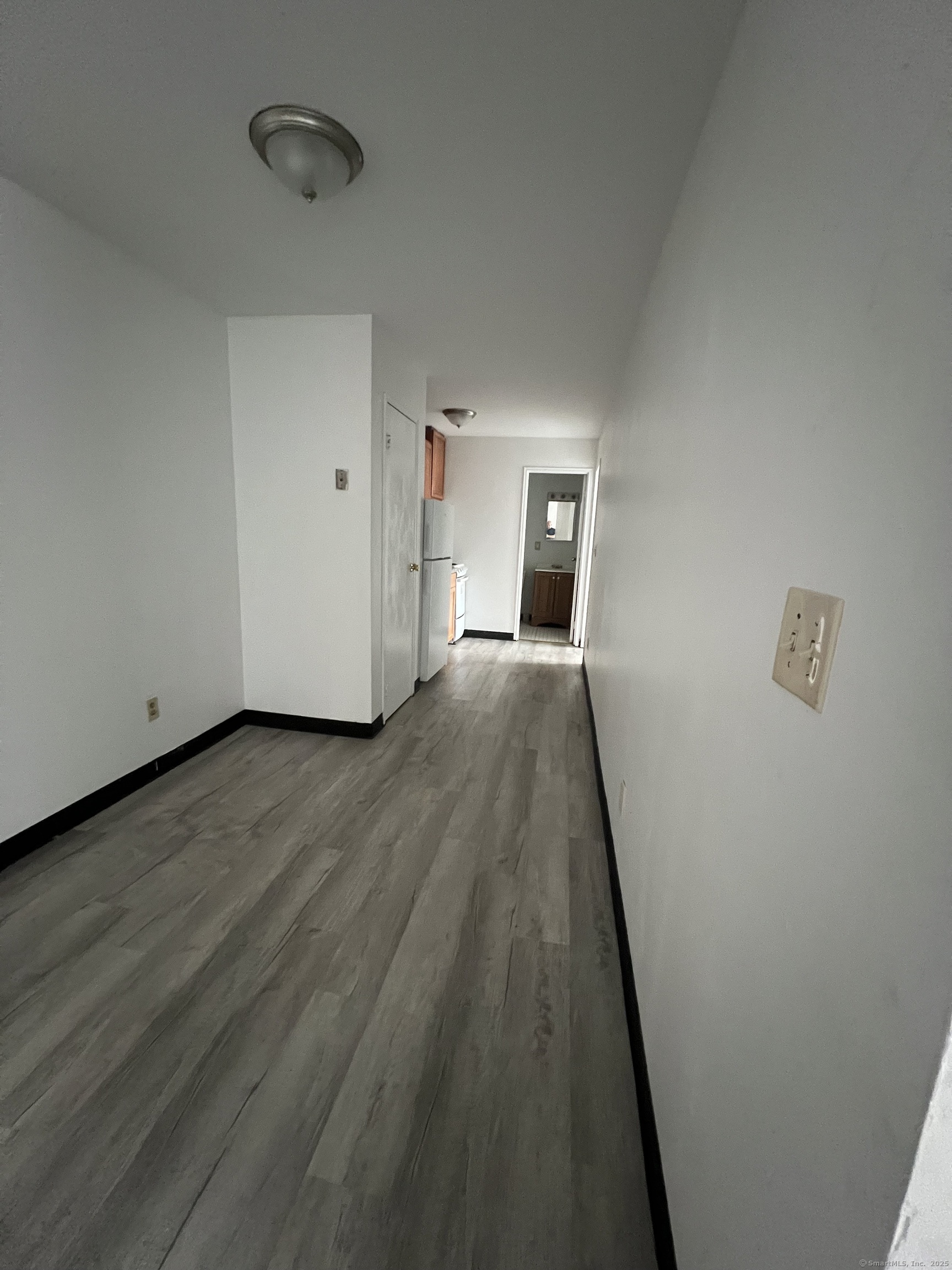 360 Palisade Avenue, Unit B09 Bridgeport, CT 06610 - Photo 4 of 8 a view of a livingroom with wooden floor