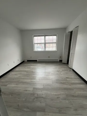 a bathroom with a toilet a sink and bathtub