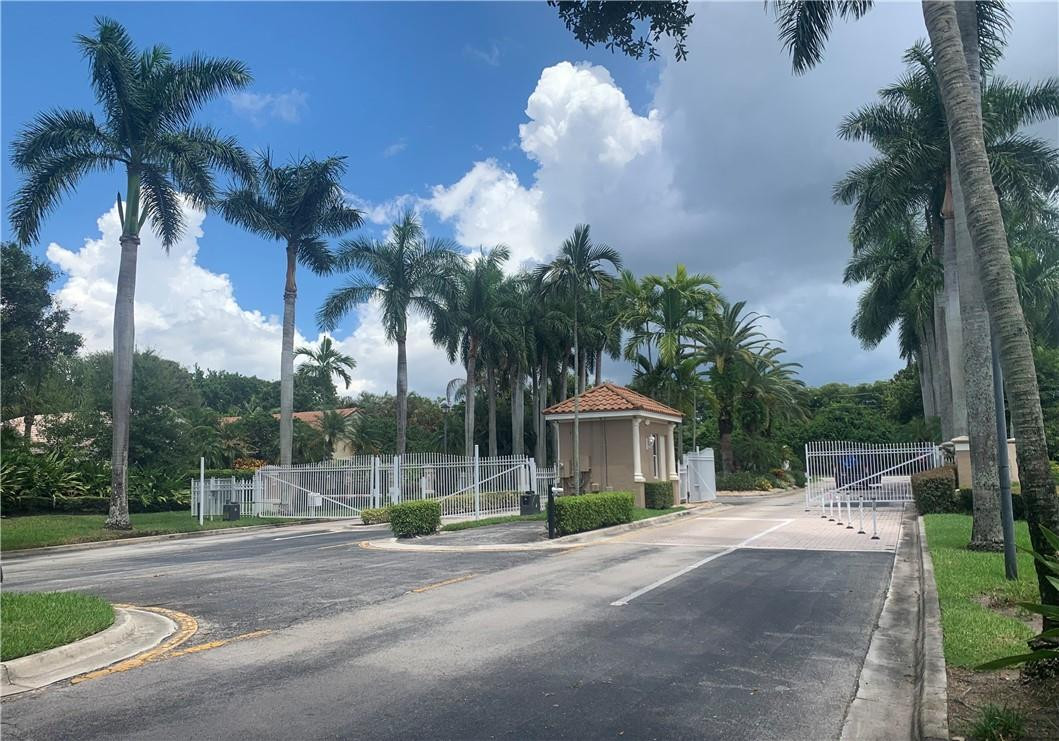 10090 Diamond Lake Road Boynton Beach, FL 33437 - Photo 6 of 34 ground shot of secondary gate