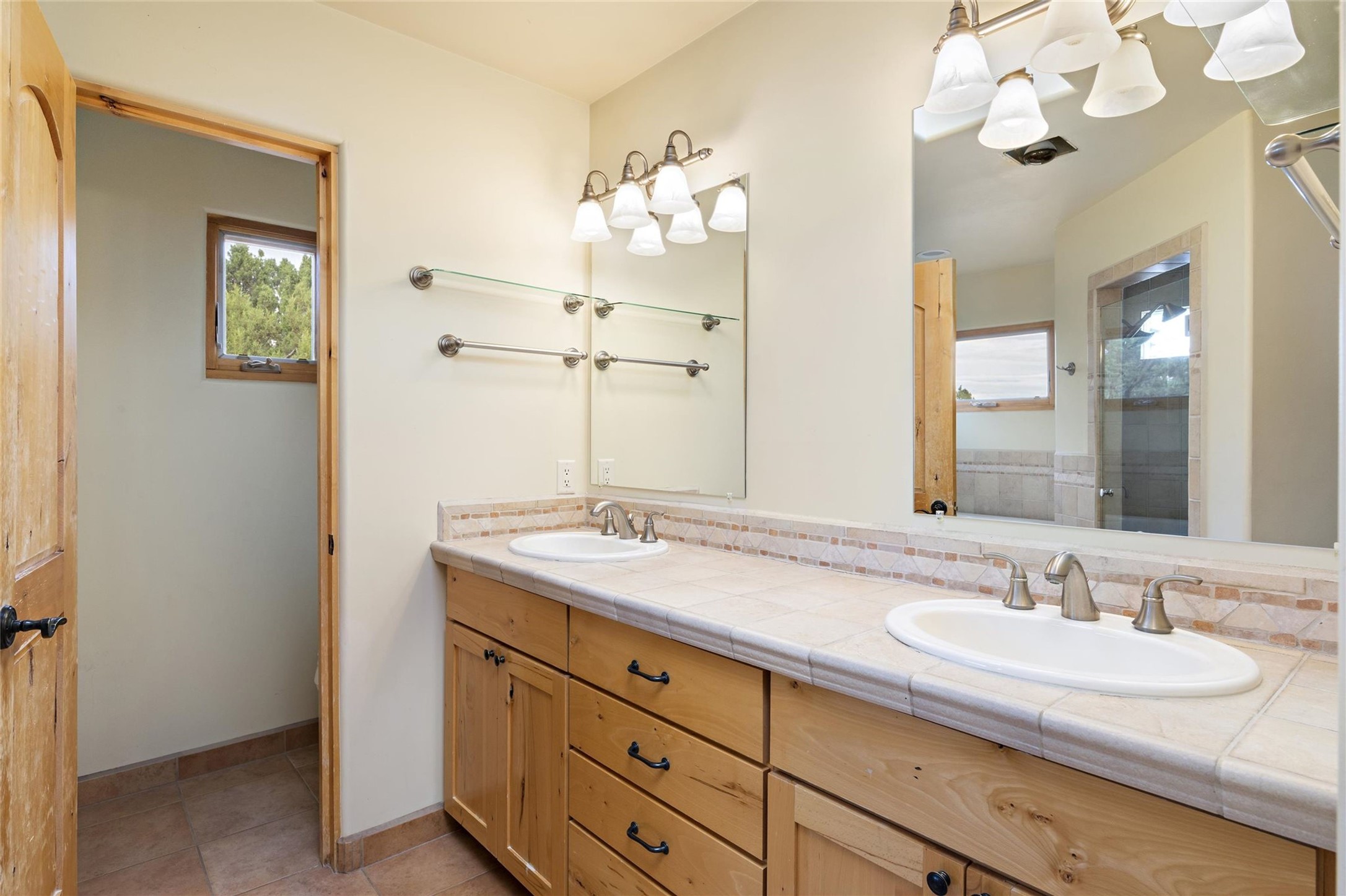 5 Rico Court Santa Fe, NM 87508 - Photo 17 of 32 Primary bedroom vanity