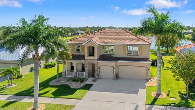 a view of house that has a lot of plants