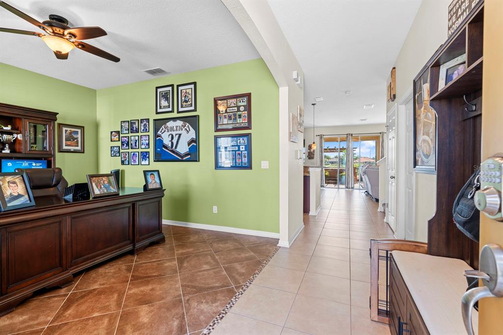 159 Star Shell Drive Apollo Beach, FL 33572 - Photo 17 of 57 a living room with furniture and a flat screen tv