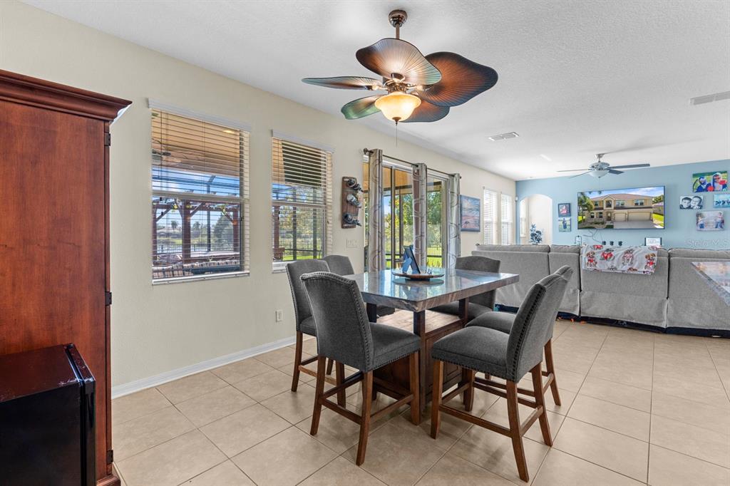 159 Star Shell Drive Apollo Beach, FL 33572 - Photo 23 of 57 a view of a dining room with furniture and chandelier