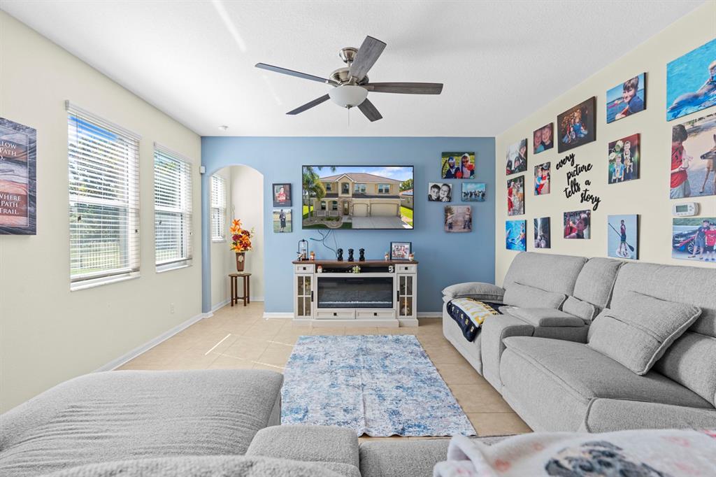 159 Star Shell Drive Apollo Beach, FL 33572 - Photo 26 of 57 a living room with furniture and a fireplace