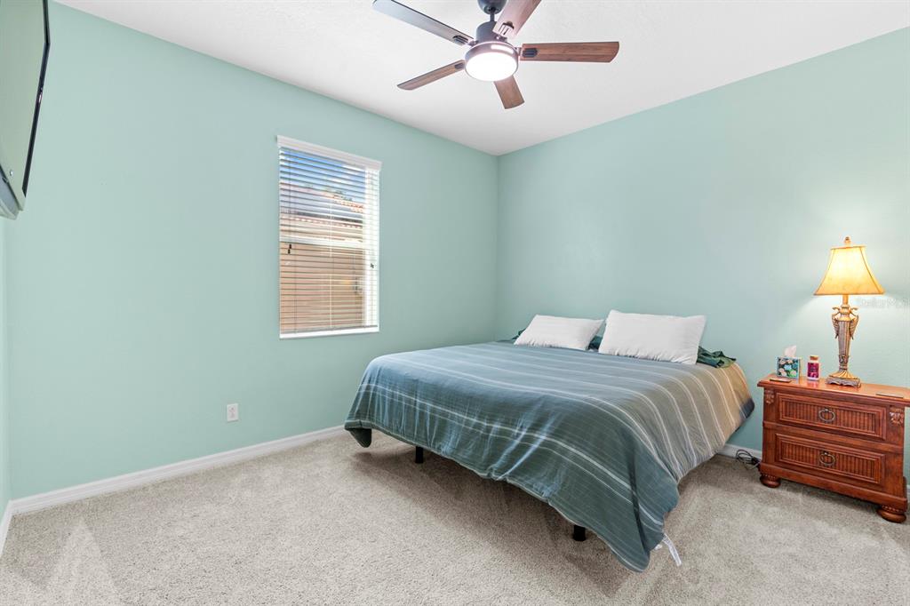 159 Star Shell Drive Apollo Beach, FL 33572 - Photo 28 of 57 a bedroom with a bed and a window