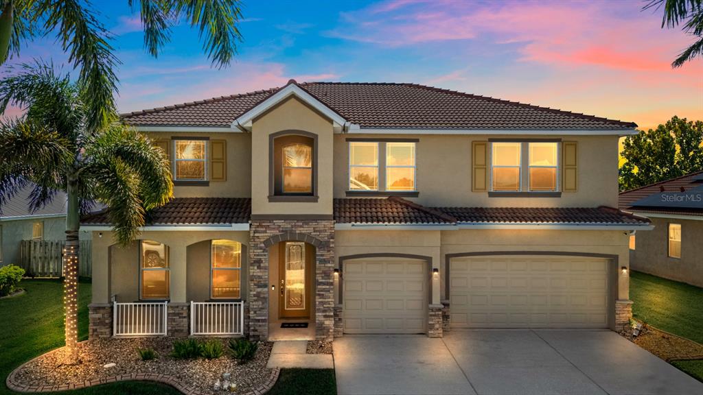 159 Star Shell Drive Apollo Beach, FL 33572 - Photo 3 of 57 a front view of a house with lots of windows and plants