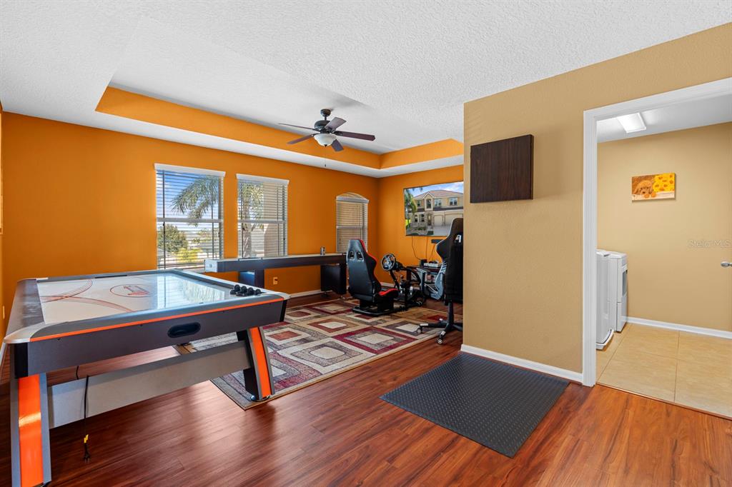 159 Star Shell Drive Apollo Beach, FL 33572 - Photo 33 of 57 a room with gym equipment equipment wooden floor and window