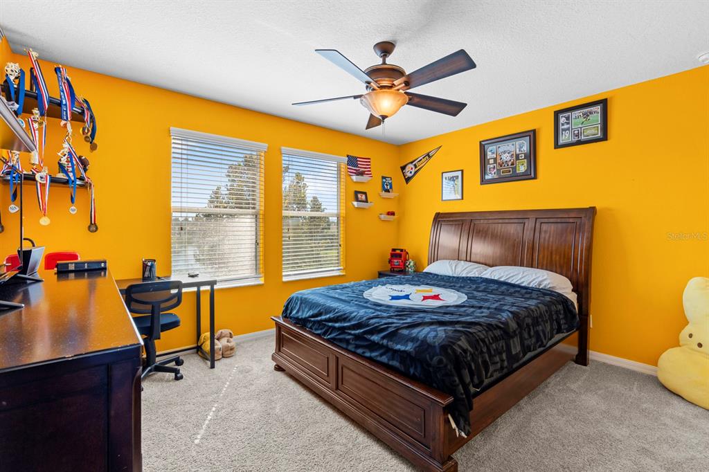 159 Star Shell Drive Apollo Beach, FL 33572 - Photo 40 of 57 a bed room with a bed and a chandelier