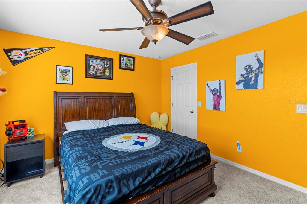 159 Star Shell Drive Apollo Beach, FL 33572 - Photo 41 of 57 a bedroom with a bed and a table in it