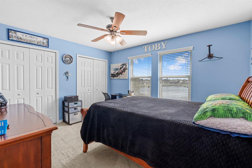 159 Star Shell Drive Apollo Beach, FL 33572 - Photo 42 of 57 a bedroom with a bed and a dresser