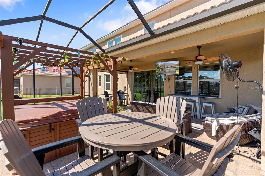 159 Star Shell Drive Apollo Beach, FL 33572 - Photo 54 of 57 a view of a patio with a table and chairs