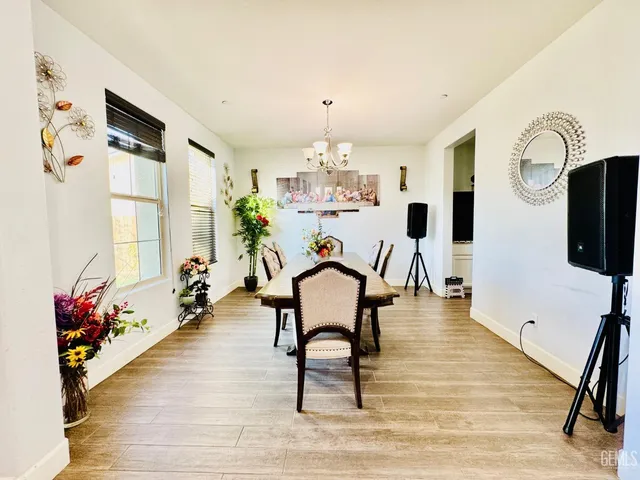 a workspace with furniture window and wooden floor