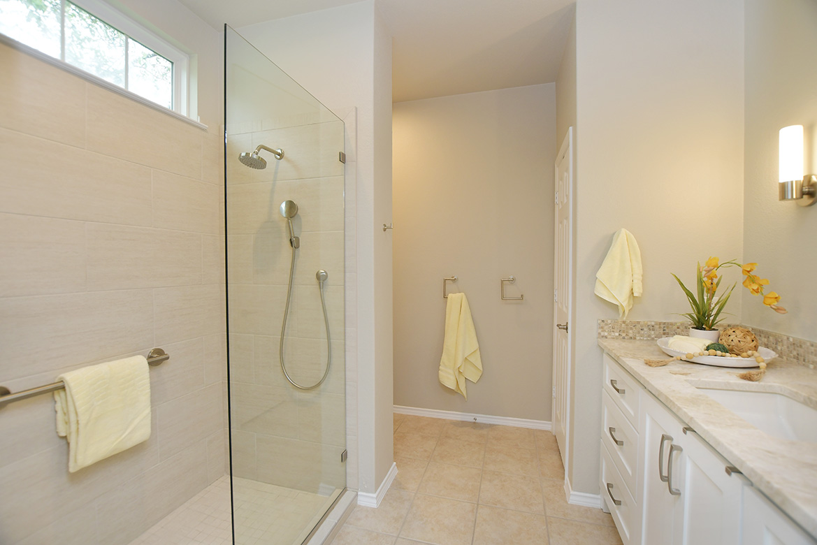 203 Winter Drive Georgetown, TX 78633 - Photo 19 of 29 Walk in to the updated shower with a transom window above, offering natural light into the primary bath.