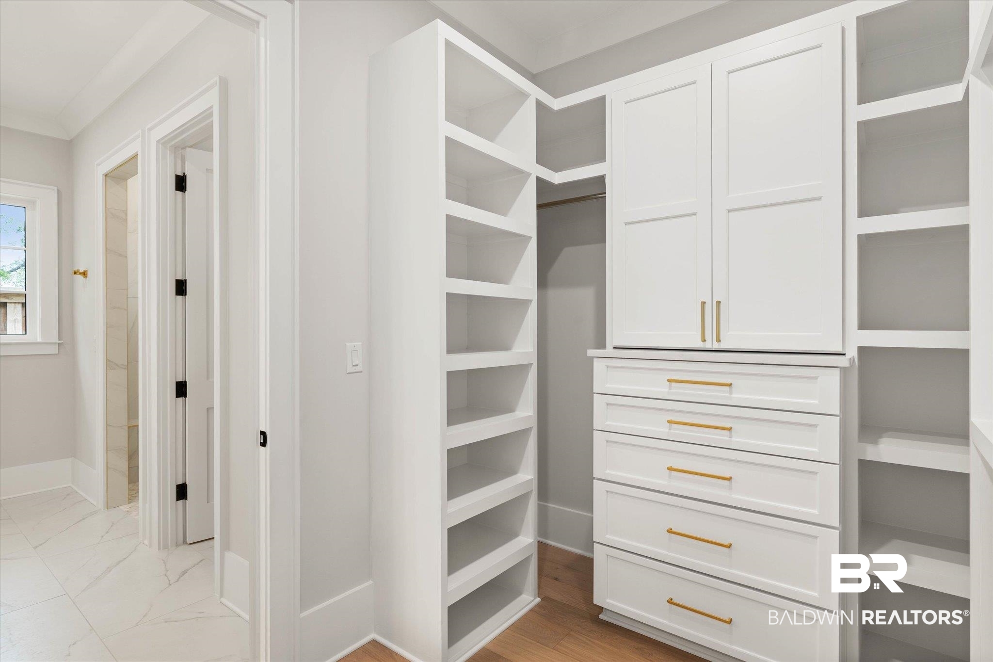 853 Inlet Circle Gulf Shores, AL 36542 - Photo 25 of 55 Walk in closet featuring marble finish floor