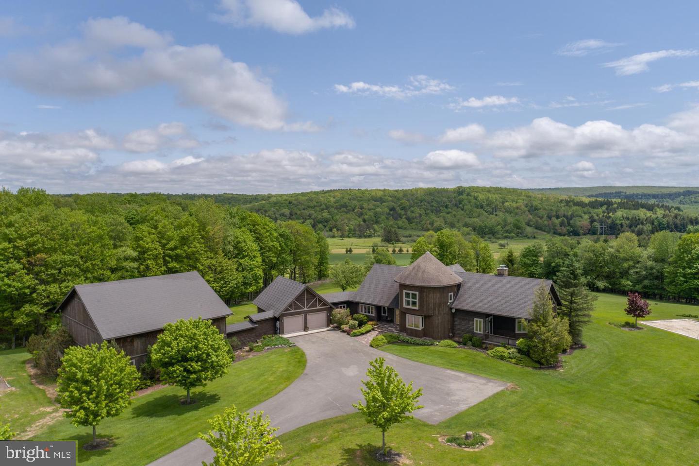 an aerial view of a house with big yard