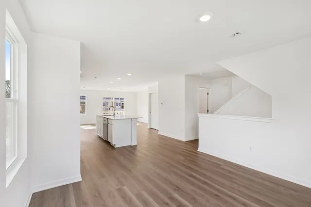 a view of a kitchen with wooden floor