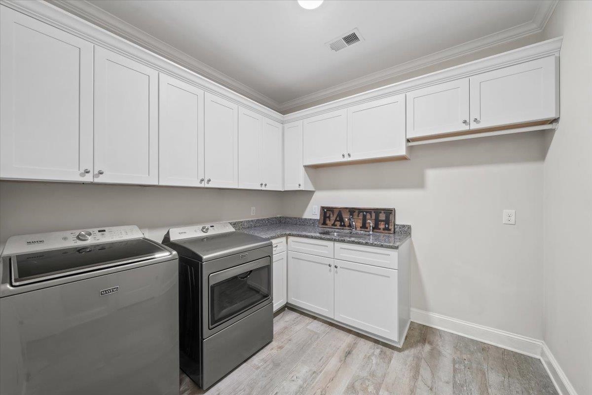 12335 Cascabel Lane Collierville, TN 38017 - Photo 16 of 38 a kitchen with granite countertop white cabinets and white appliances