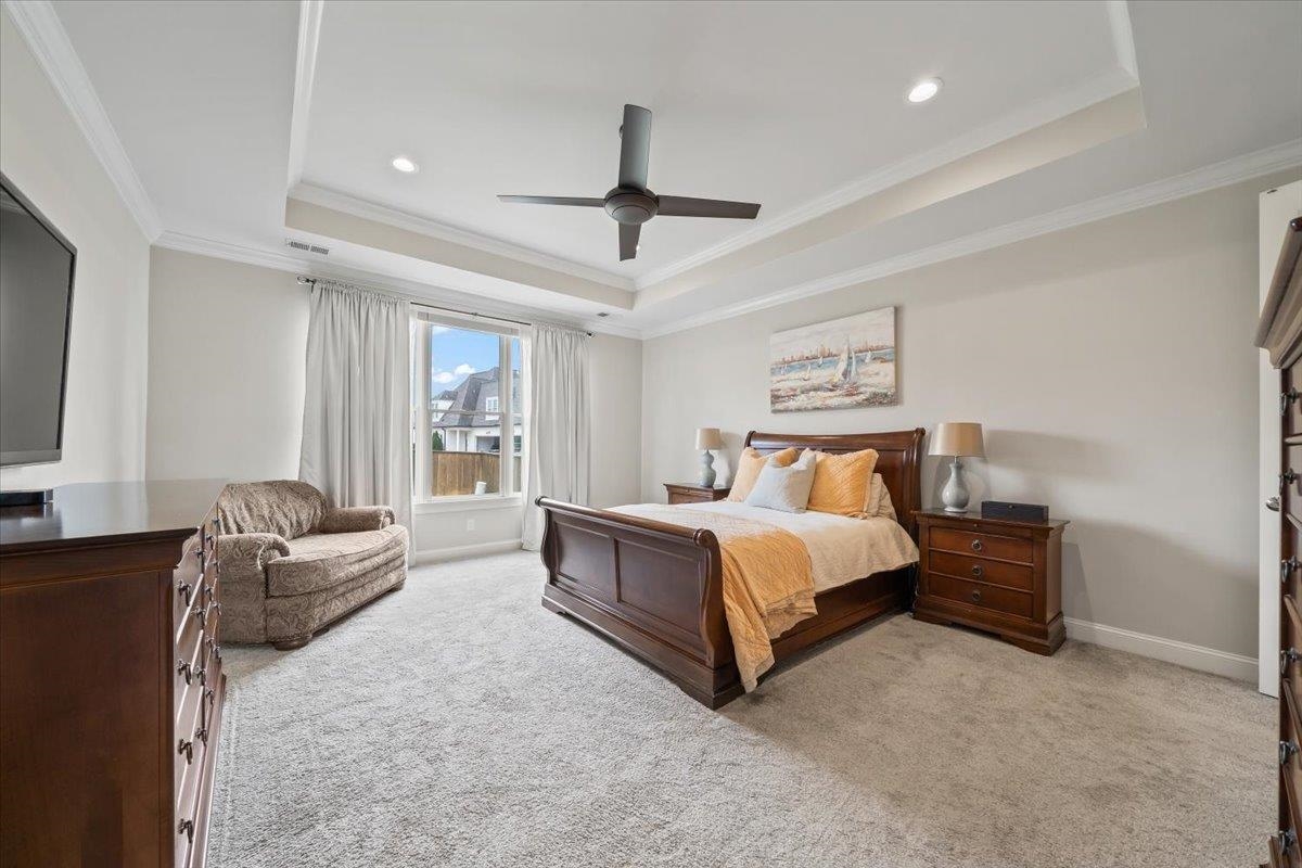 12335 Cascabel Lane Collierville, TN 38017 - Photo 17 of 38 a bedroom with a bed couch and window