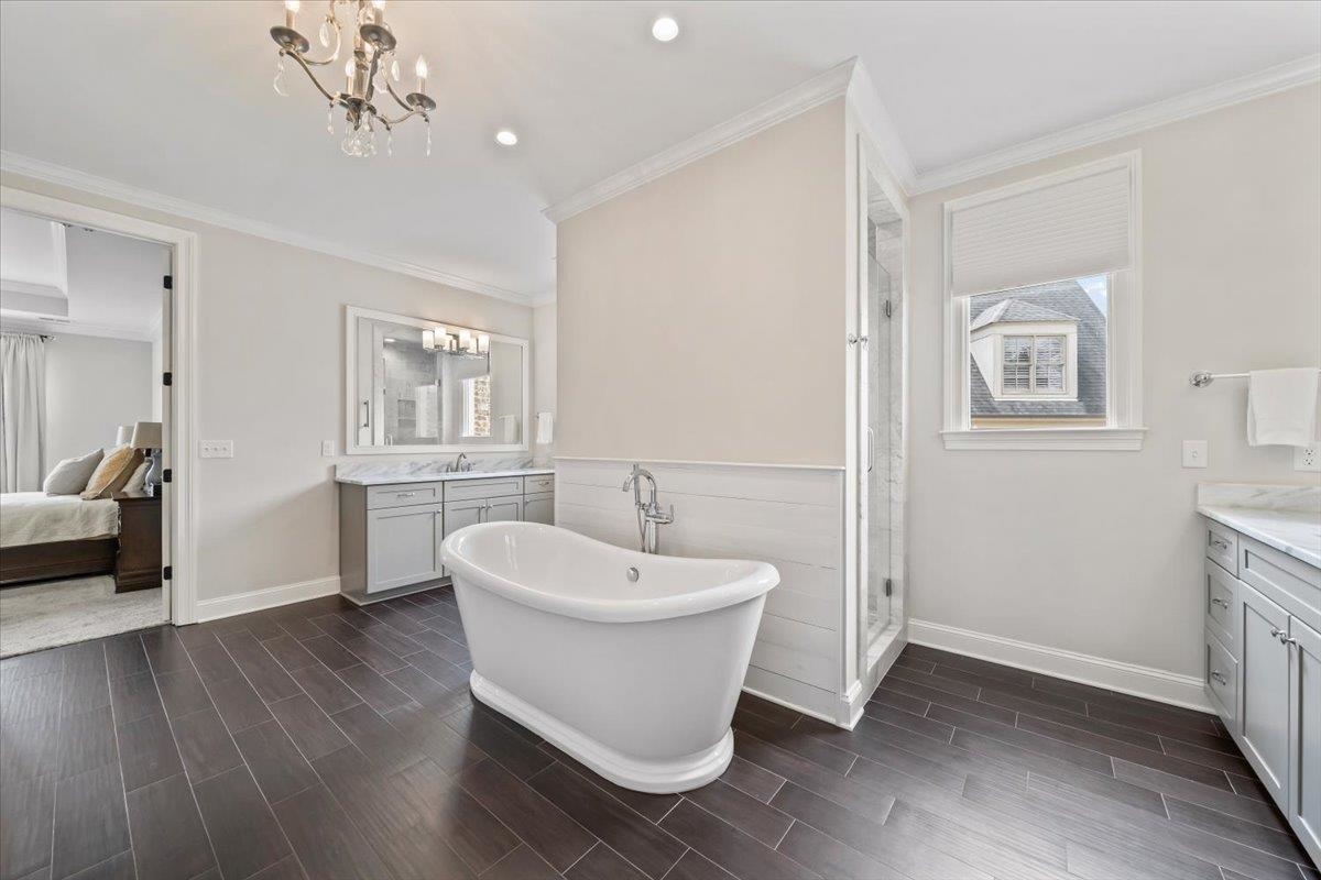 12335 Cascabel Lane Collierville, TN 38017 - Photo 20 of 38 a spacious bathroom with a sink and a mirror