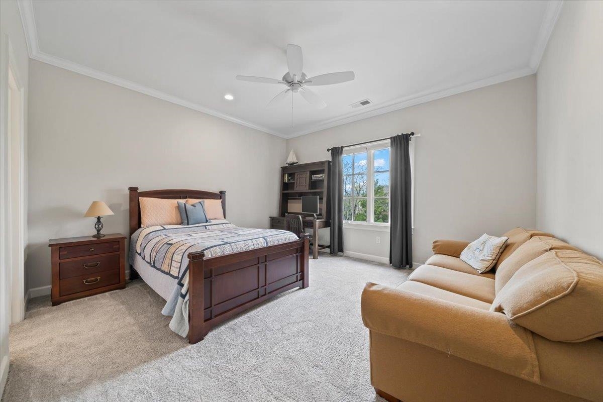 12335 Cascabel Lane Collierville, TN 38017 - Photo 23 of 38 a bedroom with a bed couch and window