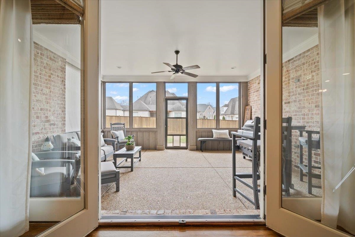 12335 Cascabel Lane Collierville, TN 38017 - Photo 29 of 38 a living room with furniture and a floor to ceiling window